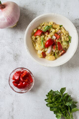 Boiled potato salad with sweet and sour peppers, celery and onion. Typical vegan dish of the...