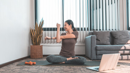 Slim fit Asian woman  Internet coach yoga and meditation coaching videos make them feel relaxed,...