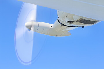 Operating engine of  airship with a rotating propeller in flight. The propeller looks like a blurry...