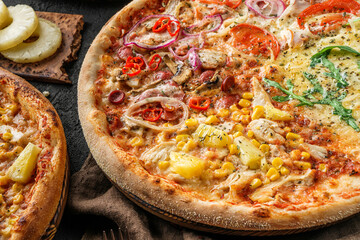 Variety of pizzas with meat, sausage, ham, prosciutto, salami, chicken fillet, pepperoni, cheese, greens, vegetables on wooden board on black background. Fast food lunch for picnic company, top view