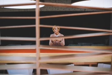 Tired female manager sitting in conference room