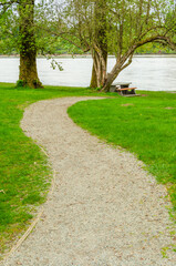 Picnic Table in Park with river or lake background.