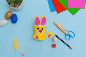 Happy Easter day.Festive craft from a paper cup with your own hands.Leisure for children.A...