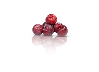 A pile of red plums isolated on white background