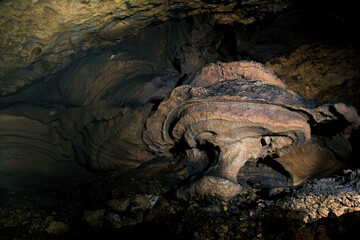Obraz premium Yogyakarta, Indonesia, Sep 18, 2014. Traces of flooding on cave wall ornaments in karst area of Gunungsewu. Karst region has underground rivers with huge potential for water resources.