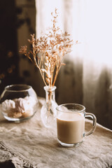 Morning coffee in pastel beige tones. Inviting kitchen.