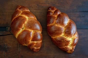 Easter tsoureki braid, greek easter sweet bread, on wooden background