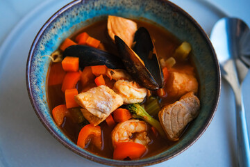 Bowl of fresh seafood soup with mussels