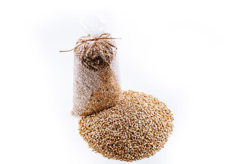 Plastic transparent bags with buckwheat grain. Mockup. Buckwheat on a white background. Roasted Buckwheat.