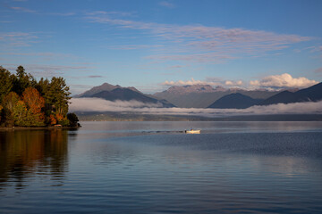 USA, Washington State, Seabeck. Fishing on Hood Canal with Olympic Mountains in the background.