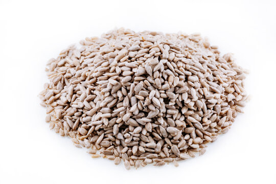 Peeled sunflower kernels. Sunflower seeds, peeled, kernels isolated on white background. Top view of sunflower seeds.
