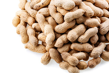 Organic peanuts in shell isolated on white background. Heap of peanut closeup. Peanuts in shells. Pile of raw peanuts in shells.