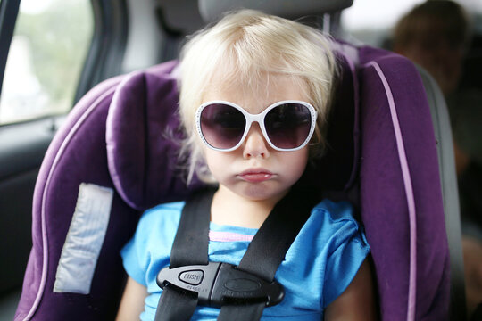 Little Toddler Child Pouting in Car Seat