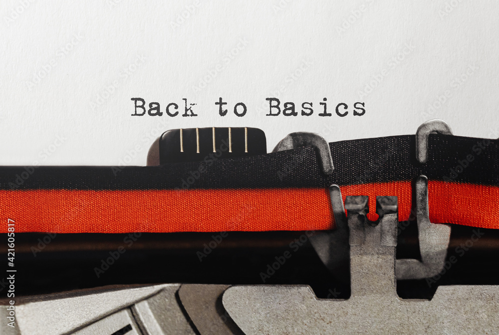 Poster text back to basics typed on retro typewriter