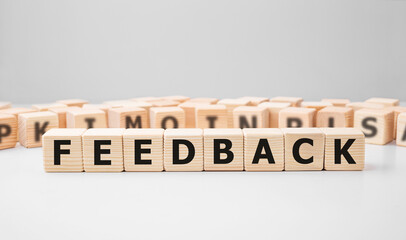 Word FEEDBACK made with wood building blocks