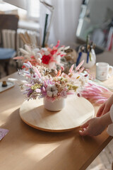 A bouquet of dried flowers of beautiful gentle tones. Bridal bouquet or bouquet as a gift for a holiday. Stabilized flowers