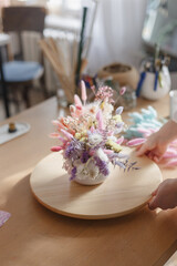 A bouquet of dried flowers of beautiful gentle tones. Bridal bouquet or bouquet as a gift for a holiday. Stabilized flowers