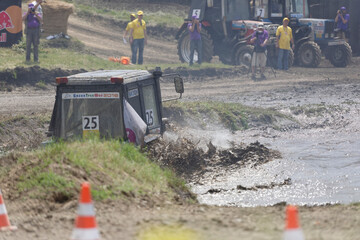   Rostov-on-Don, Russia- June 05,2016: Competition for agricultural tractors on the Bizon Track Show.Tractor overcome the water barrier. Press pictures of the race © aleks