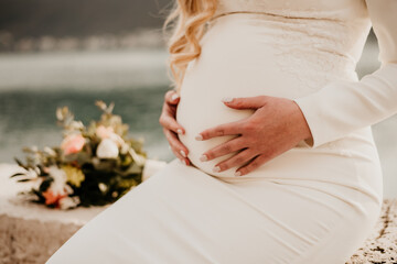 romantic wedding pregnant baby expecting hads on babybump
