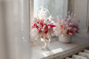 
A bouquet of dried flowers of beautiful gentle tones. Bridal bouquet or bouquet as a gift for a holiday. Stabilized flowers