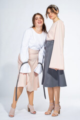 Young white girls isolated on light grey