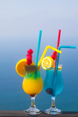 Exotic decorated Cocktails over the sea background