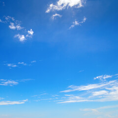 Naklejka na ściany i meble Bright blue sky with clouds.