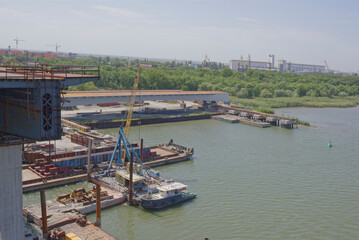 Fototapeta na wymiar Two bridges. Construction of new and repair old in Rostov-on-Don