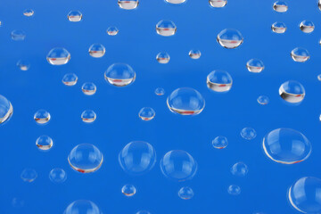 Background, water drops on blue background.
