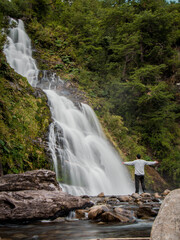 Salto el Leon, Aysen, Chile, Man in front of a waterfall