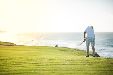 a man playing golf, on a golf course, in Varadero