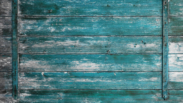 old abstract turquoise colorful painted exfoliate rustic wooden boards / wooden gate / wooden door texture, with teel bolt - wood background shabby