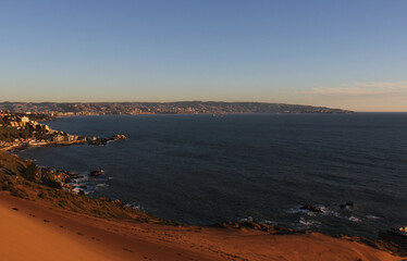 view of the Chilean coastline from the oceanfront dunes at sunset
