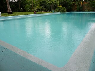 Side view, close up shot of a wwimming pool with clear waters at the Hemingway House in Key West,...