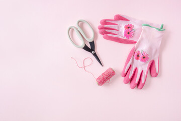 Gardening equipment and tools on pink background. Female gardening concept.