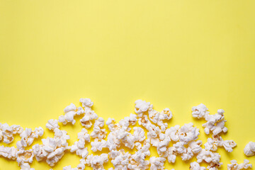 Home made popcorn on a yellow background