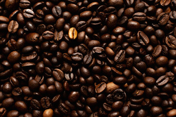 Coffee beans. Coffee beans are spread out on the surface.
