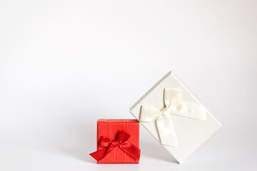 Craft gift box on a white background, decorated with a bow. For birthday, anniversary presents, gift post cards.