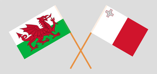 Crossed flags of Wales and Malta. Official colors. Correct proportion