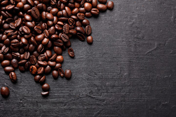 Roasted coffee beans, top view of coffee beans. Roasted coffee beans background