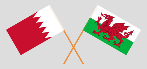 Crossed flags of Bahrain and Wales. Official colors. Correct proportion