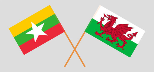 Crossed flags of Myanmar and Wales. Official colors. Correct proportion