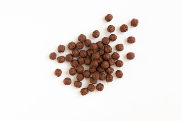 Crunchy chocolate cereal balls isolated on white background.