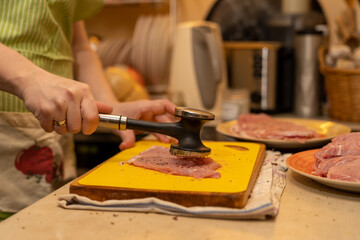 pork chop tenderize with a meat hammer in real kichen