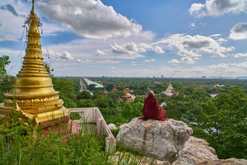 Praying on the rock, view from Mandalay Hill, Myanmar (Burma)