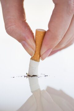 Hand putting out cigarette