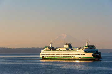 Fototapeta na wymiar USA, Washington State, Puget Sound. Seattle Bainbridge ferry framing Mount Rainier on calm morning crossing.