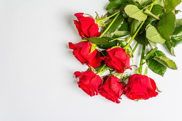A bouquet of bright red roses isolated on white background