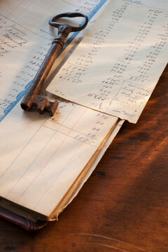 Antique Key On Top Of Ledger