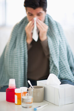 USA, New Jersey, Jersey City, Man with flu, blowing nose